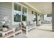 Cozy front porch with comfortable seating, neutral colors, and stylish accents, creating a relaxing outdoor space at 107 Owens Mill Place, Canton, GA 30115