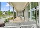 Spacious front porch with comfortable seating and hanging swing, ideal for relaxation and enjoying the neighborhood views at 107 Owens Mill Place, Canton, GA 30115