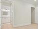 Hallway view of a bathroom with white cabinets, marble countertop, and fixtures at 107 Owens Mill Place, Canton, GA 30115