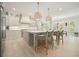 Spacious kitchen with a large center island, modern appliances, and breakfast bar seating at 107 Owens Mill Place, Canton, GA 30115
