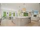 Open kitchen with island, stainless sink, modern appliances, eat-in area and view of living room at 107 Owens Mill Place, Canton, GA 30115