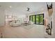 Spacious living room with hardwood floors, fireplace, modern ceiling fan, and sliding glass door to patio at 107 Owens Mill Place, Canton, GA 30115