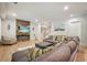 Comfortable living room featuring a fireplace, TV, plush sectional, and hardwood floors at 107 Owens Mill Place, Canton, GA 30115