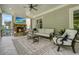 Outdoor patio with a stone fireplace, a mounted TV, and comfortable lounge seating at 107 Owens Mill Place, Canton, GA 30115