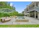 The pool is surrounded by lounge chairs and a large umbrella at 107 Owens Mill Place, Canton, GA 30115