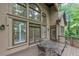Inviting back deck featuring a glass table with seating and views of the lush greenery at 1455 Lockridge Dr, Cumming, GA 30041