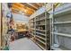 Basement workshop area offers plenty of shelving, a workbench and great potential for storage at 1455 Lockridge Dr, Cumming, GA 30041