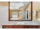 Bright bathroom featuring granite counters, a soaking tub, and a tiled shower behind clear glass at 1455 Lockridge Dr, Cumming, GA 30041