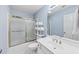 Bathroom with blue walls, tile floors, and glass enclosed shower at 1455 Lockridge Dr, Cumming, GA 30041