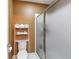 Bathroom featuring a toilet with a shelf and a glass door shower at 1455 Lockridge Dr, Cumming, GA 30041