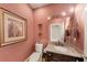 Cozy bathroom featuring a toilet, granite-look countertop, and warm lighting at 1455 Lockridge Dr, Cumming, GA 30041