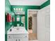 Inviting bathroom highlighting a white vanity and ample lighting, leading to an adjacent room at 1455 Lockridge Dr, Cumming, GA 30041