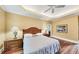 Bedroom showcasing a tray ceiling and warm color scheme at 1455 Lockridge Dr, Cumming, GA 30041