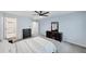 Neutral bedroom with carpet, ceiling fan, and three dressers at 1455 Lockridge Dr, Cumming, GA 30041