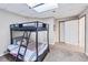 Bedroom with carpet, a bunk bed and a small window and attached bathroom at 1455 Lockridge Dr, Cumming, GA 30041