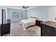 Bedroom featuring neutral walls, carpet, ceiling fan, and multiple windows at 1455 Lockridge Dr, Cumming, GA 30041