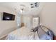 Bedroom with carpet, ceiling fan, and a television attached to the wall at 1455 Lockridge Dr, Cumming, GA 30041