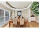Dining room with a large window, hardwood floors, and a table set for six at 1455 Lockridge Dr, Cumming, GA 30041