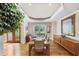 Dining room featuring hardwood floors, large window, and a table set for six at 1455 Lockridge Dr, Cumming, GA 30041
