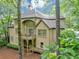 Rear exterior view of the house featuring two decks and surrounding trees at 1455 Lockridge Dr, Cumming, GA 30041