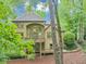 Exterior of home with a deck, lush greenery, and a stone path at 1455 Lockridge Dr, Cumming, GA 30041