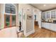 Beautiful foyer featuring hardwood floors, an impressive front door with decorative glass, and columns at 1455 Lockridge Dr, Cumming, GA 30041