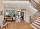 Inviting foyer with hardwood floors, stairs, and access to a living area at 1455 Lockridge Dr, Cumming, GA 30041