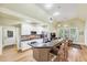 Open-concept kitchen featuring an island with barstool seating and stainless steel appliances at 1455 Lockridge Dr, Cumming, GA 30041