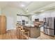 Spacious kitchen with stainless steel appliances, granite countertops, and a large center island at 1455 Lockridge Dr, Cumming, GA 30041