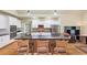 Updated kitchen featuring granite countertops, stainless steel appliances and a large central island at 1455 Lockridge Dr, Cumming, GA 30041