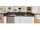 Modern kitchen island with granite countertop, ample cabinet space, and stainless steel dishwasher at 1455 Lockridge Dr, Cumming, GA 30041