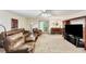 Living Room with carpet, leather furniture, and a big screen television at 1455 Lockridge Dr, Cumming, GA 30041