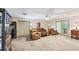 Living Room with carpet, leather furniture, and a ceiling fan at 1455 Lockridge Dr, Cumming, GA 30041