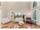 Bright living room with hardwood floors and multiple seating options, plus lots of natural light at 1455 Lockridge Dr, Cumming, GA 30041