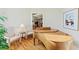 Bright piano room features hardwood floors, decorative chairs, and a wood baby grand piano at 1455 Lockridge Dr, Cumming, GA 30041