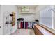 Well-organized walk-in closet with built-in shelving, hanging rods, and a storage dresser at 1455 Lockridge Dr, Cumming, GA 30041