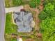 Aerial view of an estate property with lush green lawns, mature trees, and impeccable landscaping at 710 Eastbourne Ct, Alpharetta, GA 30005