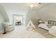Bright bedroom features neutral decor, a cozy chair, and playful teepee adding charm to this inviting space at 710 Eastbourne Ct, Alpharetta, GA 30005