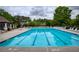 Large community pool with marked lanes, ample deck space, and lounge chairs for residents' enjoyment at 710 Eastbourne Ct, Alpharetta, GA 30005