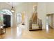 Light filled foyer features hardwood floors and staircase with a view into the dining room at 710 Eastbourne Ct, Alpharetta, GA 30005