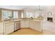 Open-concept kitchen features stainless appliances, ample counter space and is open to a breakfast nook and living area at 710 Eastbourne Ct, Alpharetta, GA 30005