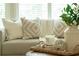 Close up of pillows and decor on the sofa in the bright and inviting living room at 710 Eastbourne Ct, Alpharetta, GA 30005