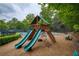 Fun playground with slides and climbing equipment at the Westbury community, surrounded by trees and greenery at 710 Eastbourne Ct, Alpharetta, GA 30005