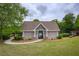 Attractive pool house with a shake-style exterior and elegant pathway amid a manicured lawn at 710 Eastbourne Ct, Alpharetta, GA 30005