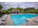 A large community pool area with ample seating and an attractive pool house at 710 Eastbourne Ct, Alpharetta, GA 30005