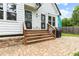 Charming backyard patio with brickwork, wooden stairs, and grill at 969 Oak Sw St, Atlanta, GA 30310