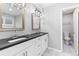 Elegant bathroom featuring double sinks, granite countertops, and modern fixtures at 969 Oak Sw St, Atlanta, GA 30310