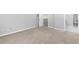 Neutral bedroom with large carpeted floor, white trim, gray walls, and bathroom access at 969 Oak Sw St, Atlanta, GA 30310