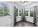 Cozy breakfast nook with views of the backyard, hardwood floors, and natural lighting at 969 Oak Sw St, Atlanta, GA 30310