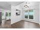 Cozy dining area featuring an updated chandelier, hardwood floors, and natural lighting at 969 Oak Sw St, Atlanta, GA 30310
